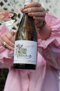 Leefield Station Sauvignon Blanc – Beauty – Woman holding bottle