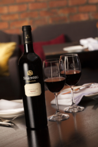 Simonsig Redhill Pinotage – Beauty – On Table with Glasses